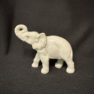 White Ceramic Elephant Figurine with gold touches.